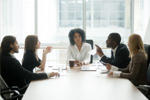 stock-photo-multiracial-people-having-dispute-about-bad-document-at-group-meeting-african-businessman